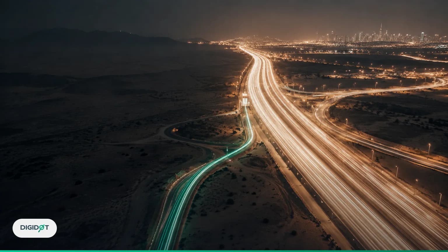Aerial night view of a desert highway interchange where a broad river of white light trails dwarfs one thin emerald side road, a metaphor for AI referral traffic beside Google organic